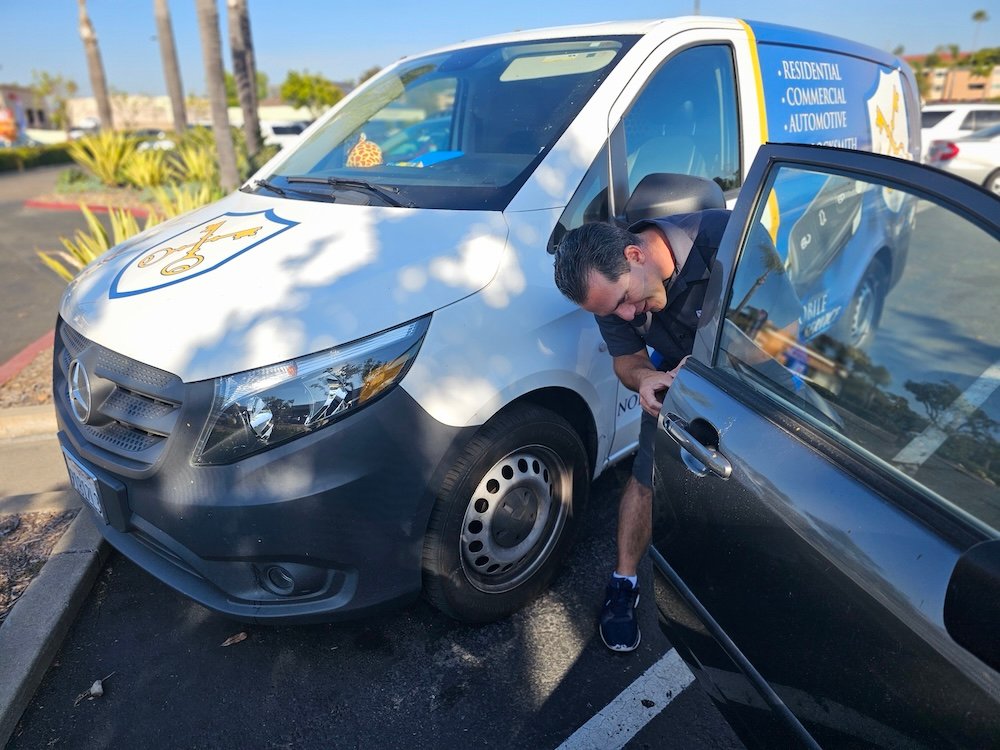 locksmith fixing a lock of a car door