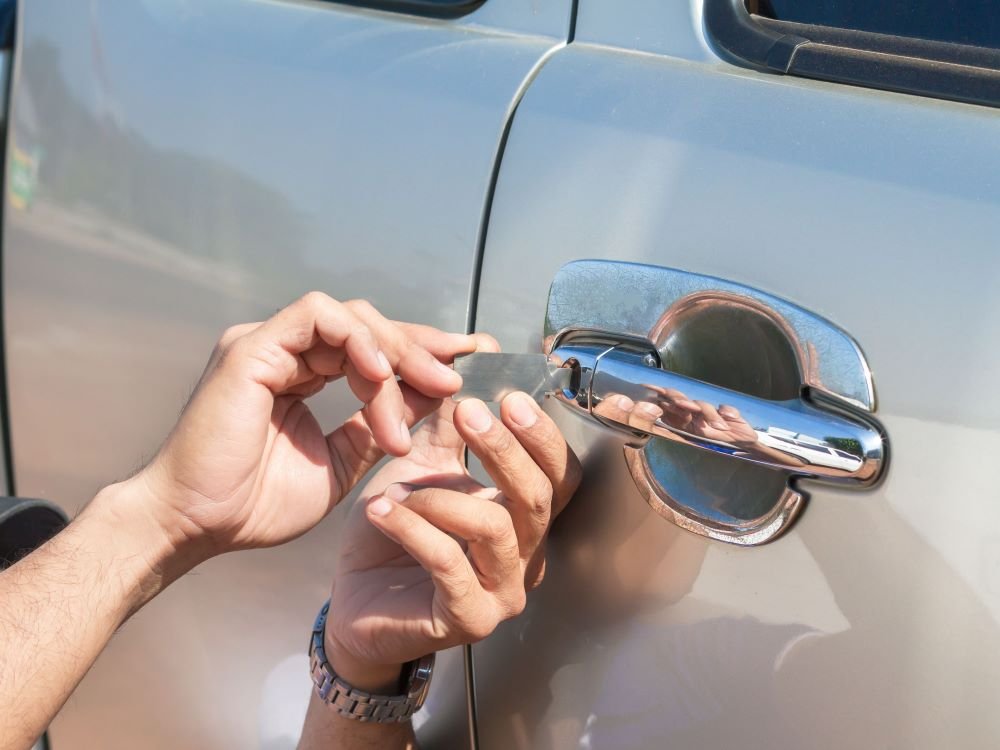 Car key programming Bellerose NY close up shot two hands trying to open the car door