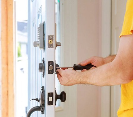 Deadbolt installation Bellerose NY using screw driver in door lock