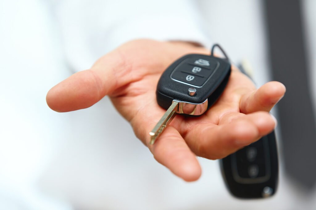 Transponder key programming Bellerose NY close up shot hand holding a car key