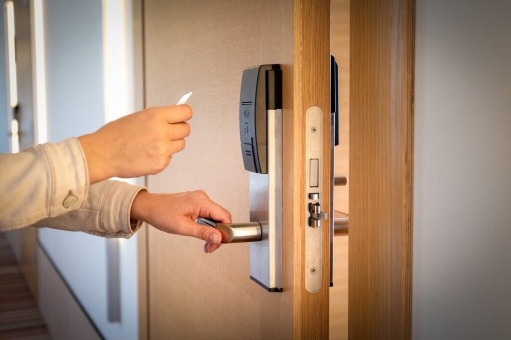 hand holing a card and a handle of a smart lock
