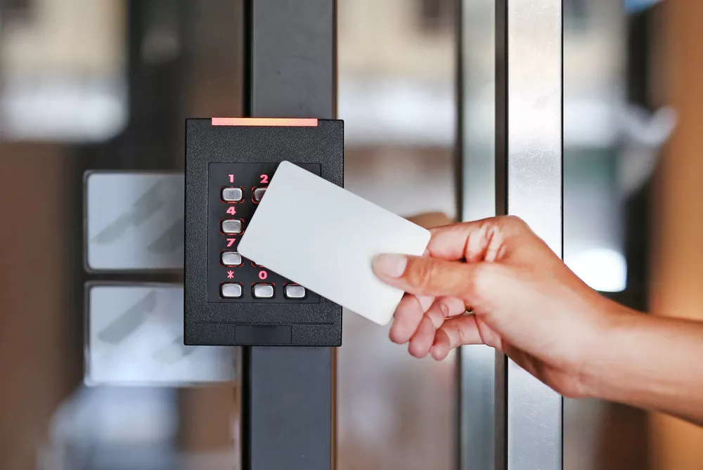 hand swiping a card in digital lock